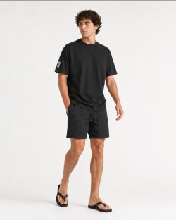 Man wearing the UVEA TIKI cotton t-shirt, full body front view
