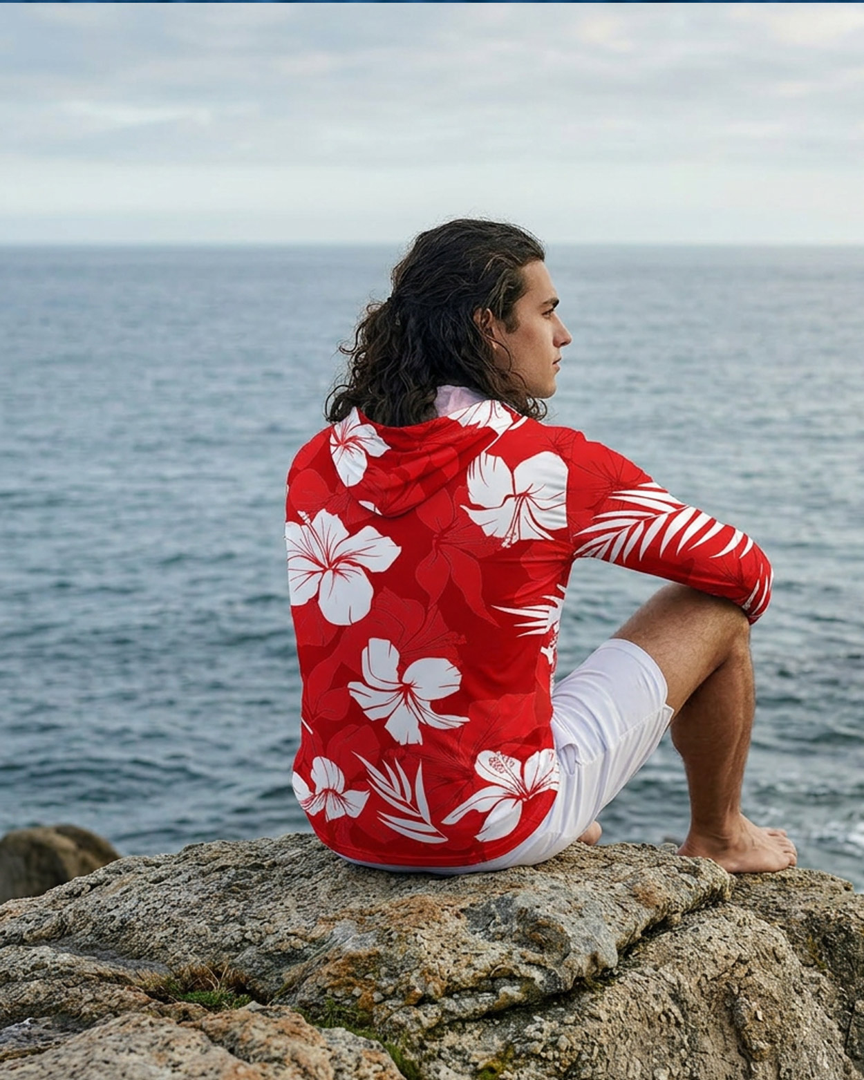 homme assis en rashguard a capuche